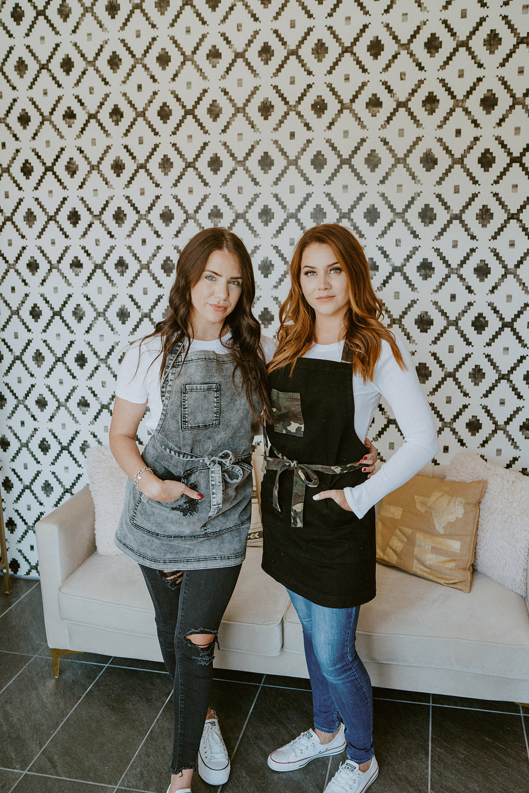 Stylist wearing black camo apron