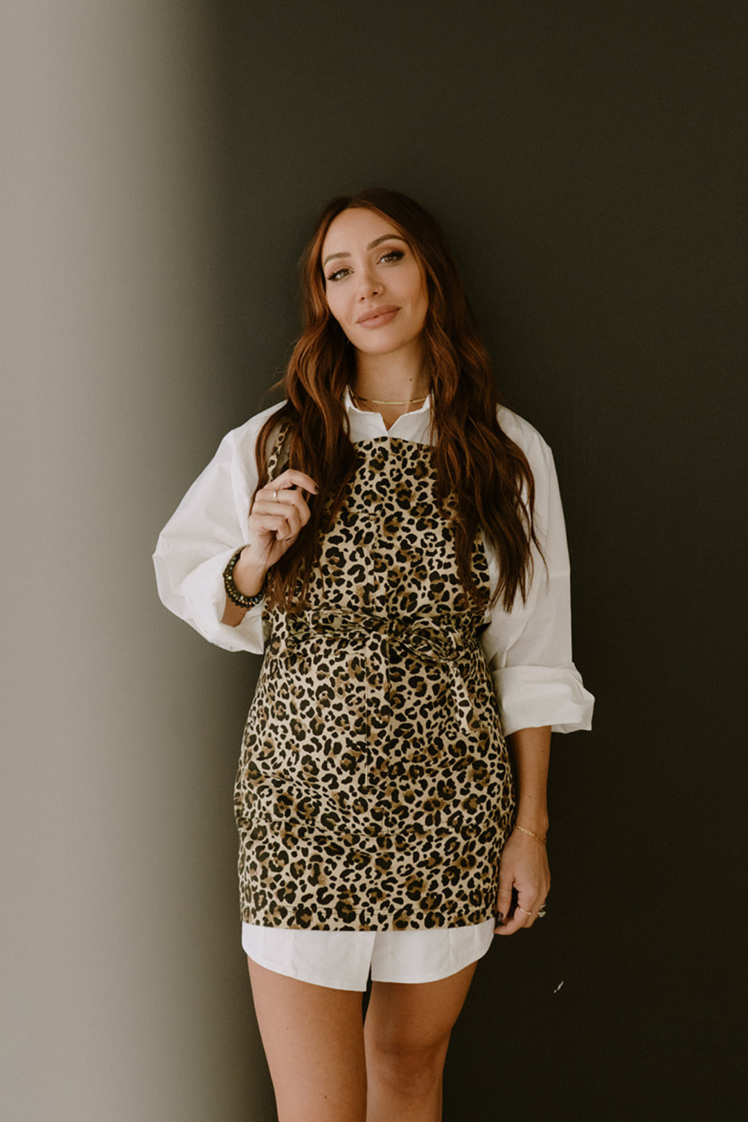 The Leo apron by J Clark Designed styled on female model wearing an oversized white dress shirt.