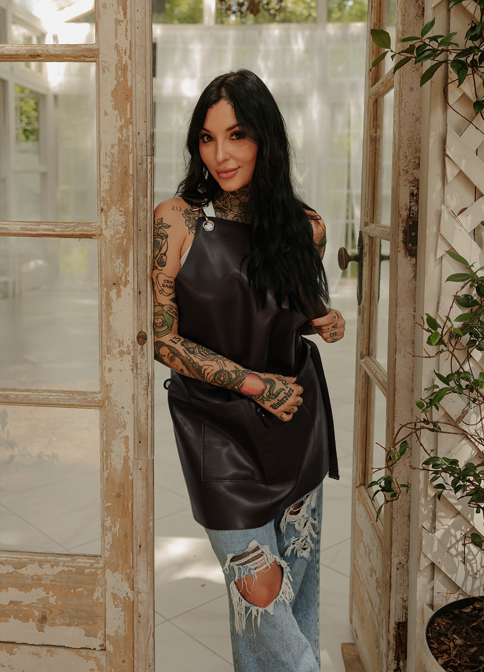 Full black leather apron lifestyle photo on model by Jclark designed