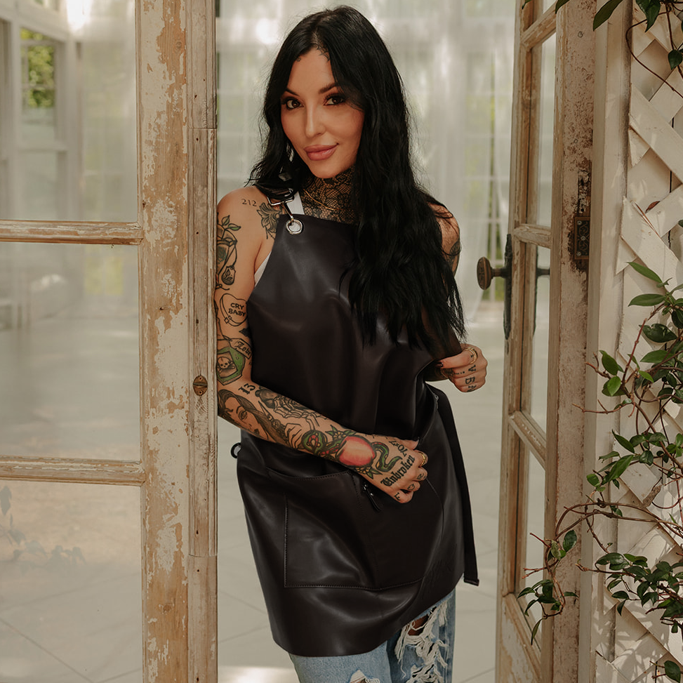 Full black leather apron lifestyle photo on model by Jclark designed
