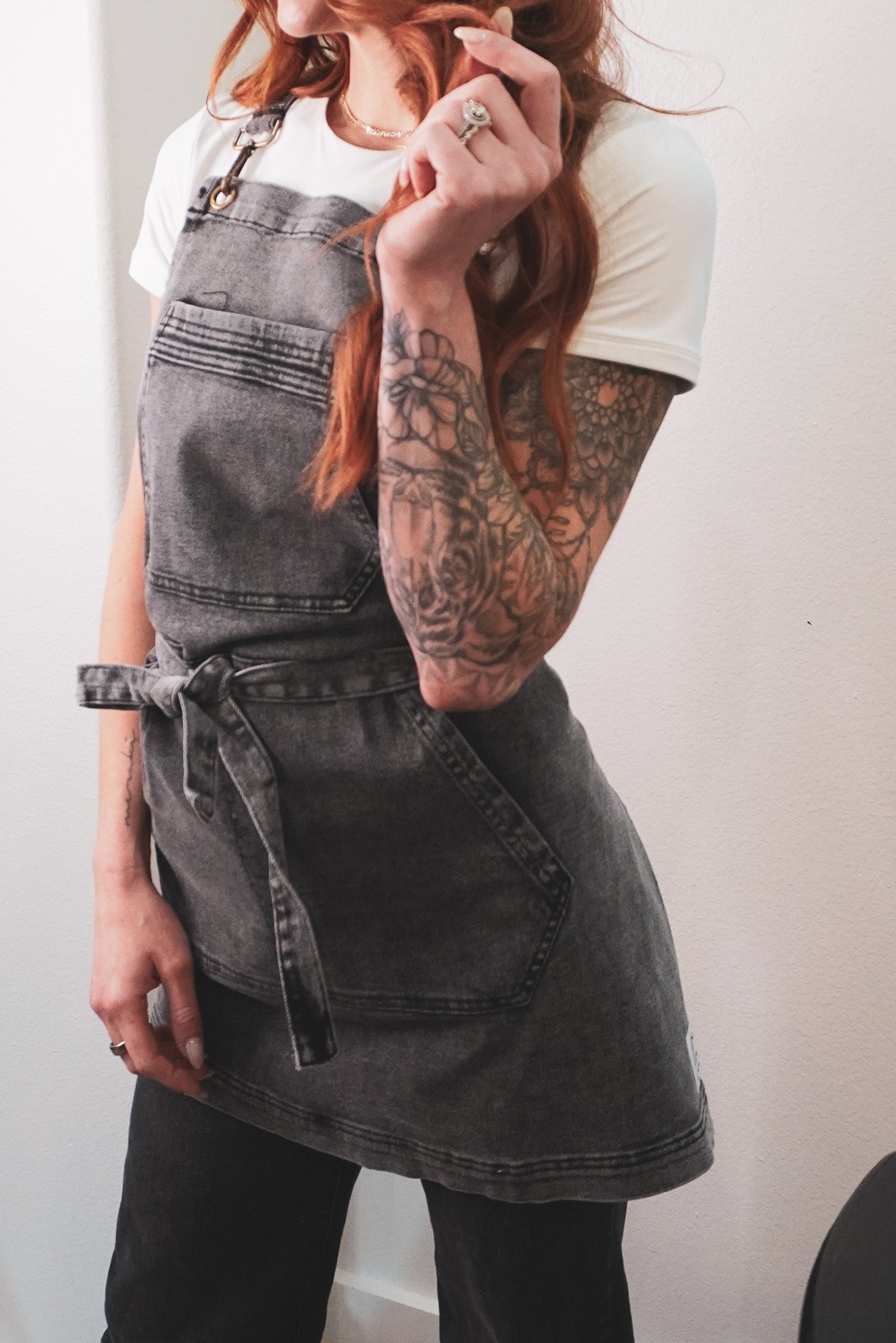 Over shoulder black acid washed apron by J Clark Designed worn on female model