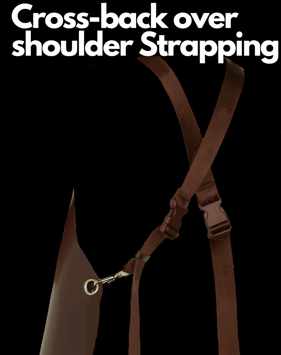 Image shows the back straps of the Cocoa Brown Leather Apron by J Clark Designed against a black background with white text "Cross-back over shoulder strapping"