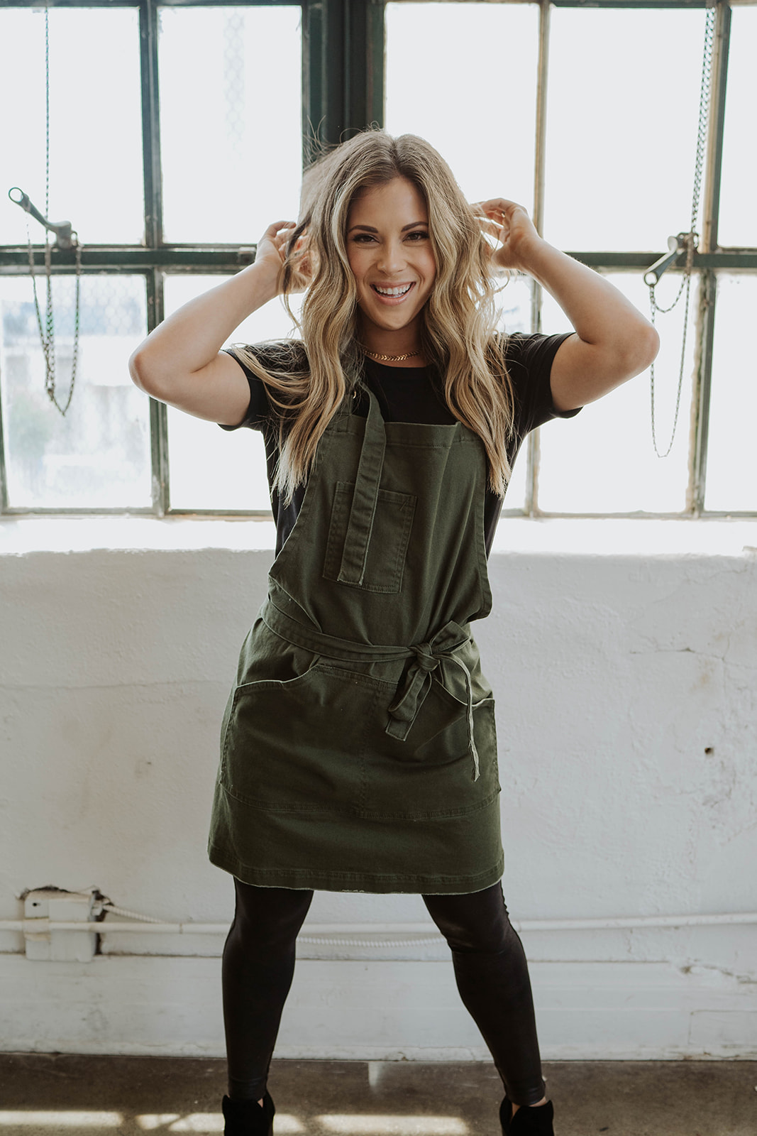 Female model wearing Olive Green Apron by J Clark Designed